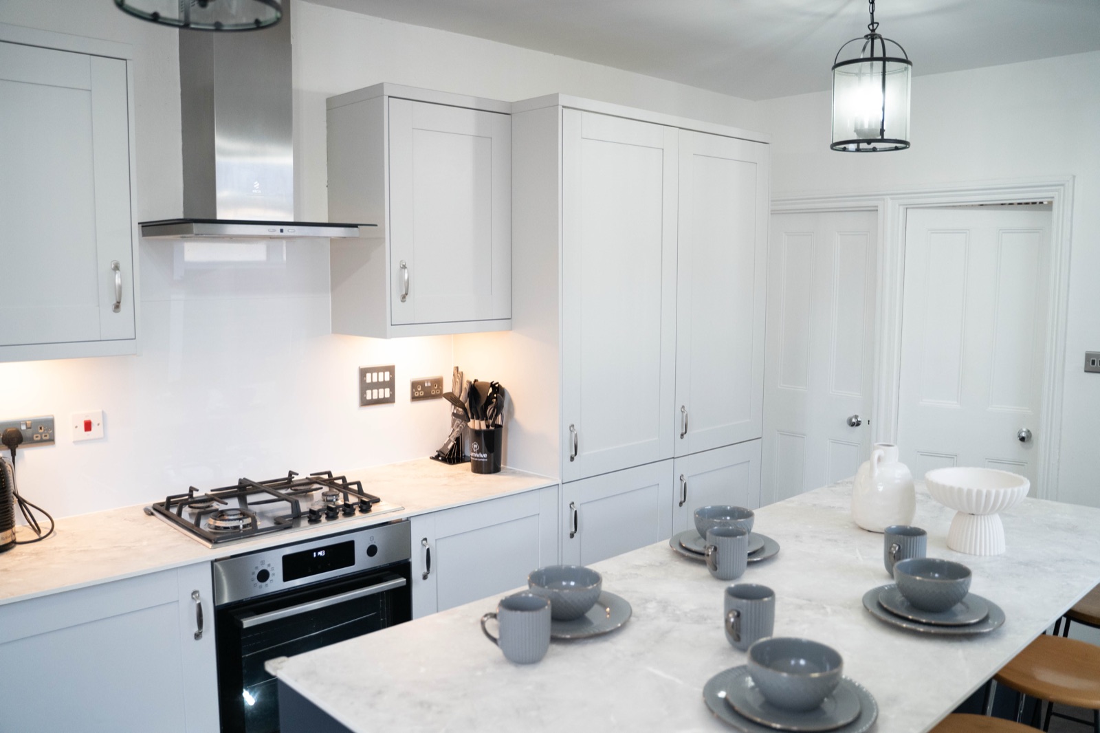 Kitchen at Cecil House — grey shaker cabinets, marble worktop