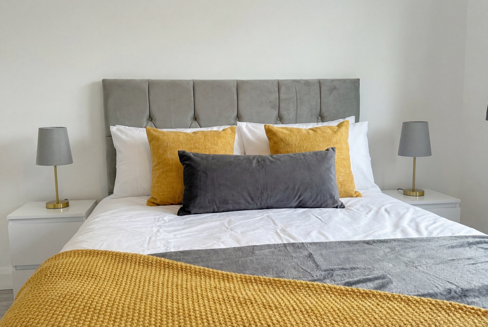 Bedroom at Whitefoot House — mustard accents